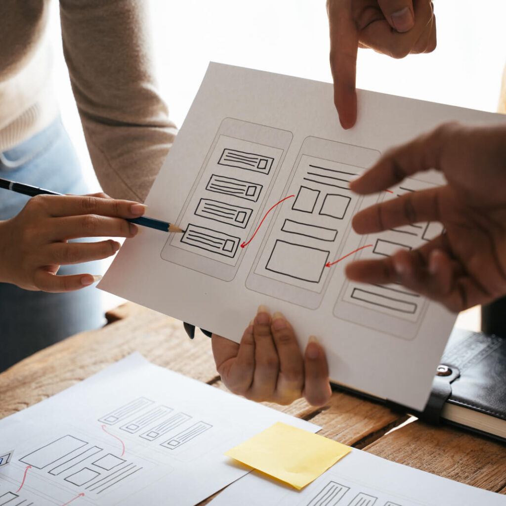 people collaborating on design diagram